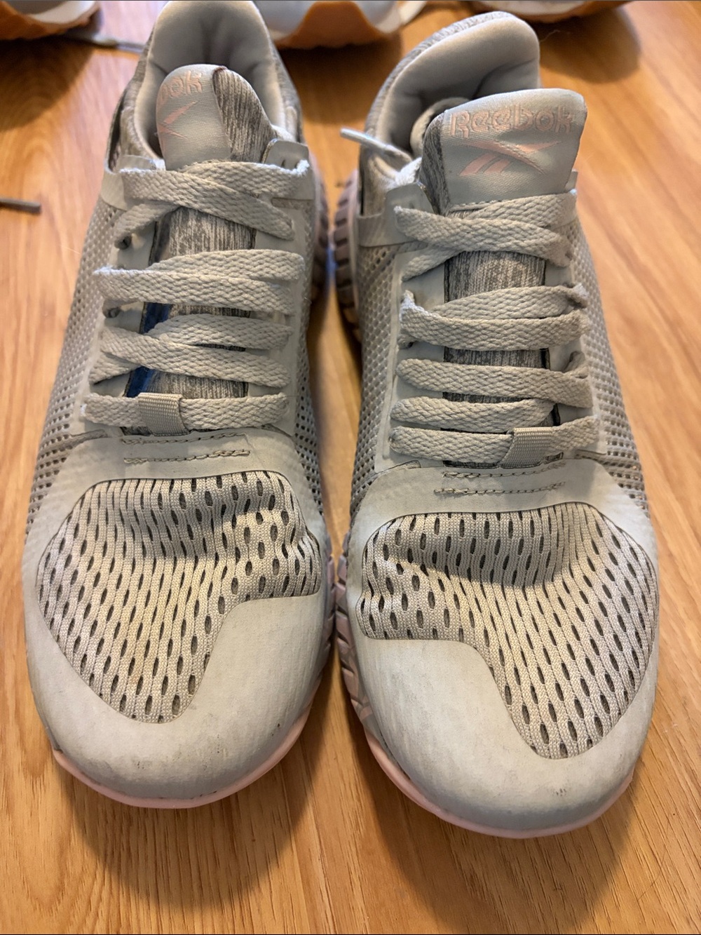Reebok women’s Light Gray Sneakers with Pale Pink Accents